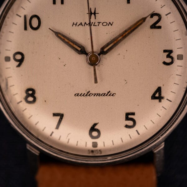 Hamilton Accumatic lower dial macro with italic automatic script and SWISS marking above six o'clock