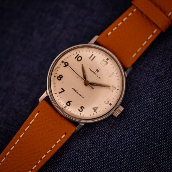 Hamilton Accumatic A-507 top-down view of textured silver dial with full Arabic numeral configuration