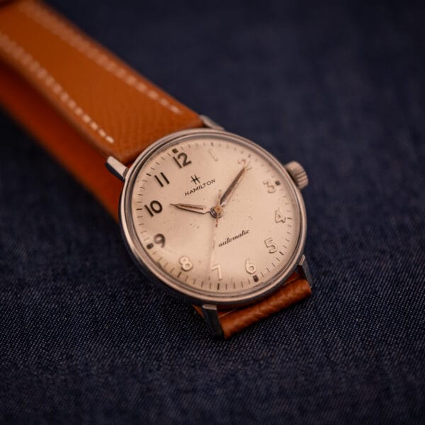 Hamilton Accumatic A-507 angled view showing applied dauphine hands and crown signed Hamilton