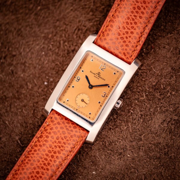 Baume & Mercier Hampton MV045063 angled view of the polished stainless case showing the right-side crown and brown lizard strap