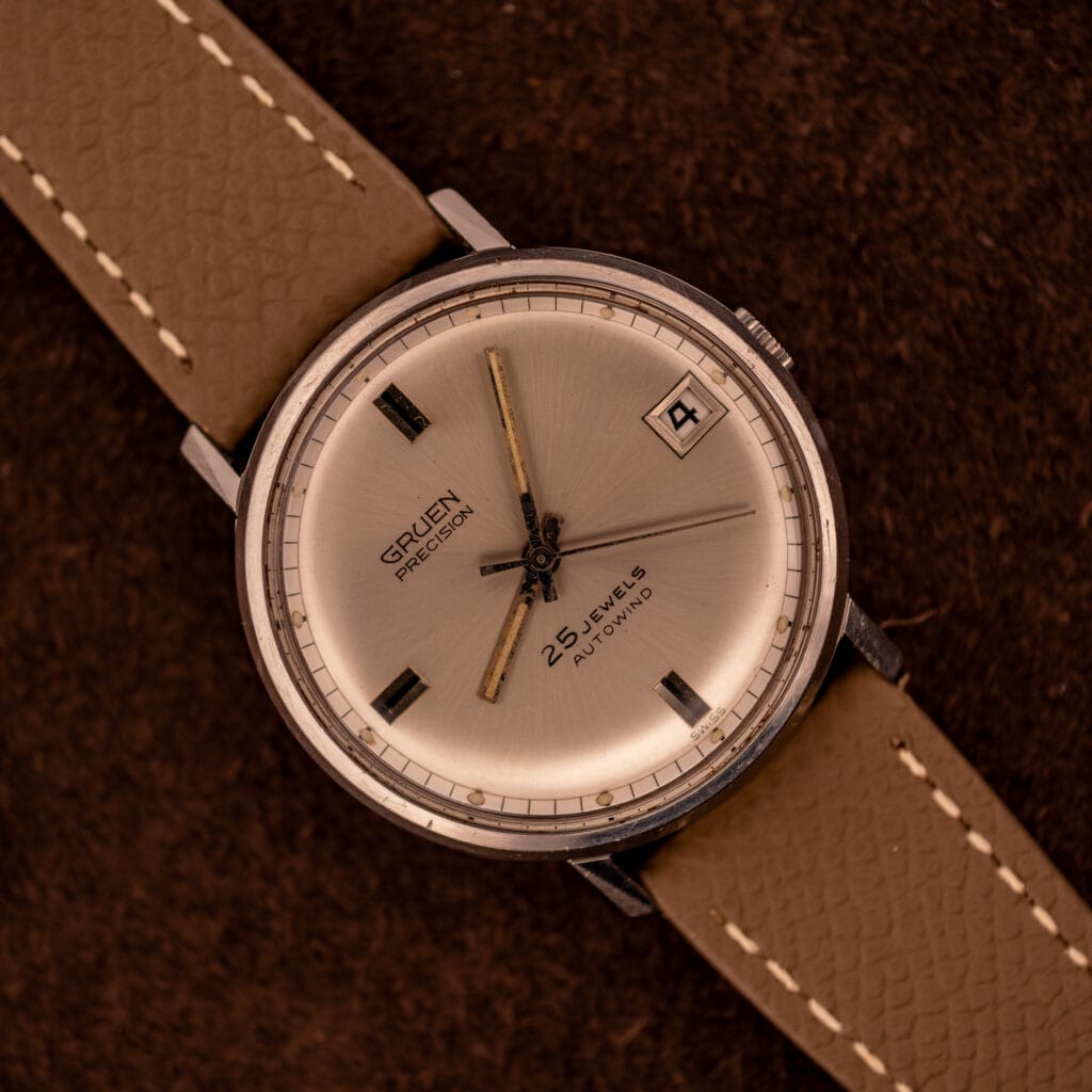 Vintage Gruen Precision Autowind on mud grey Saffiano leather strap with silver sunburst dial and date at three