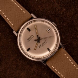 Vintage Gruen Precision Autowind on mud grey Saffiano leather strap with silver sunburst dial and date at three