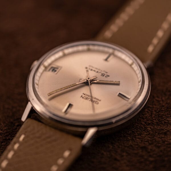 Gruen Precision Cal. 712 CA dial on mud grey Saffiano strap with cream contrast stitching, angled view