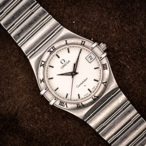 Vintage Omega Constellation 1512.30 Manhattan quartz on suede, full view of cushion stainless steel case and 1552/862 bracelet
