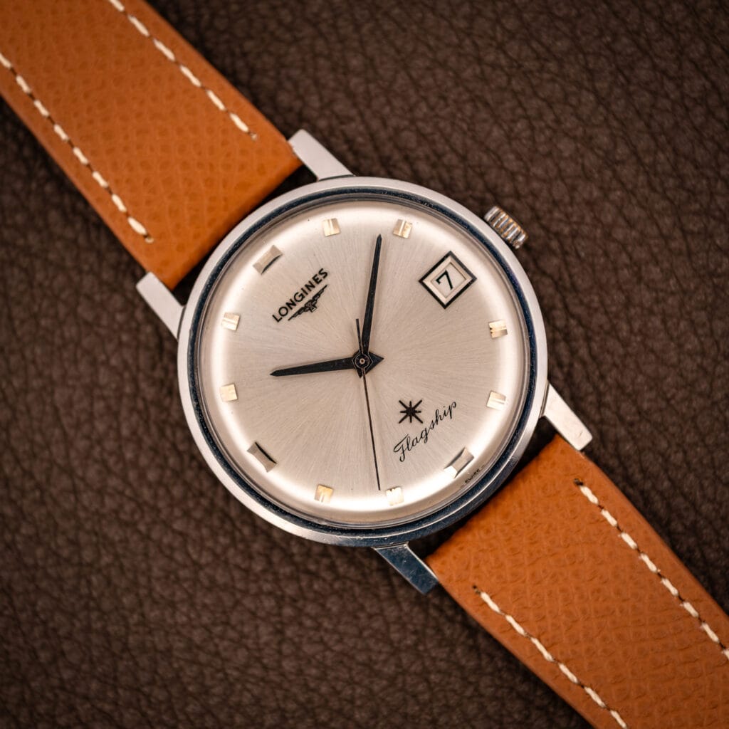 Vintage Longines Flagship Ref. 2821-285 silver sunburst dial with applied gold baton markers, date at three, on tan saffiano leather strap