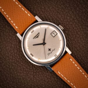 Vintage Longines Flagship Ref. 2821-285 silver sunburst dial with applied gold baton markers, date at three, on tan saffiano leather strap