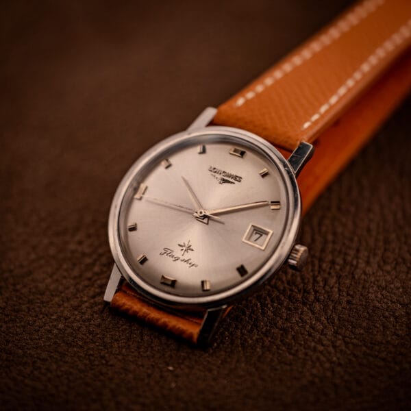 Longines Flagship reference 2821-285 top-down dial view with thin black central seconds across the factory silver sunburst finish