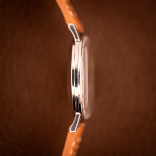 Opposite side profile of the Longines Flagship 2821-285 showing the thin polished bezel and flat lyre lug tops