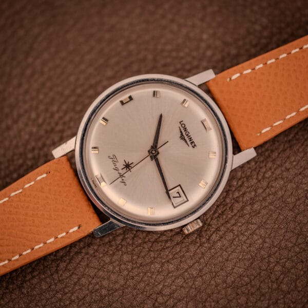 Vintage Longines Flagship 2821-285 photographed flat on textured leather, classic mid-century dress watch presentation