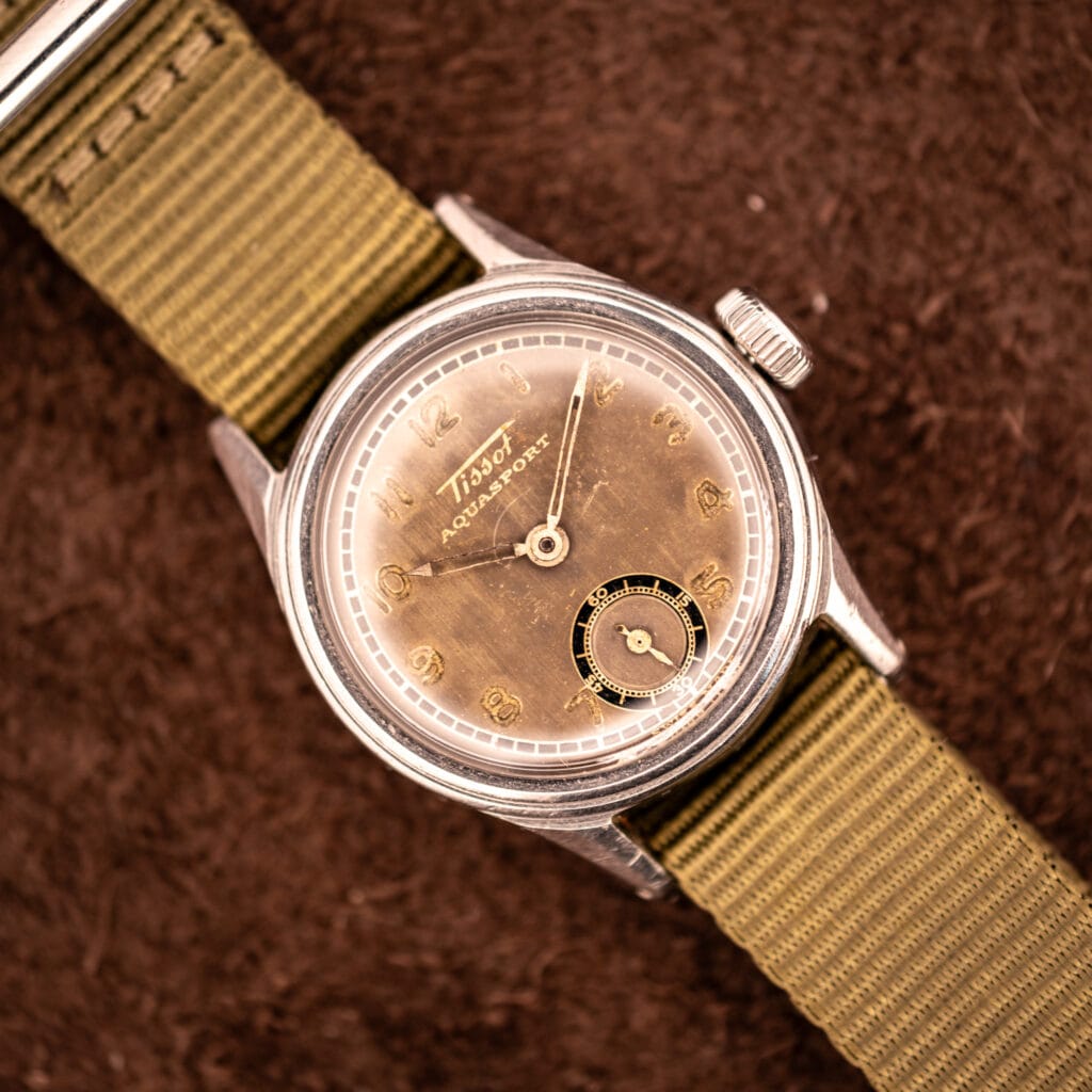 Vintage Tissot Aquasport reference Cal. 27 with tropical bronze dial, gilt Arabic numerals, on olive green canvas military strap