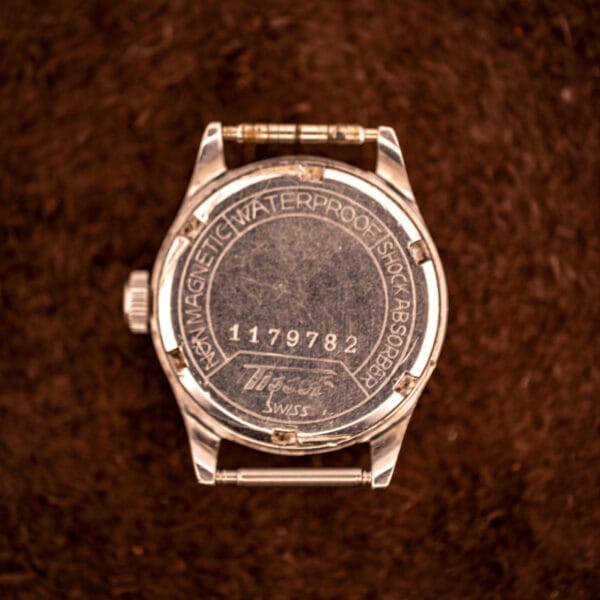 Tissot Aquasport outer caseback engraved NON MAGNETIC WATERPROOF SHOCK ABSORBER with serial 1179782 and Tissot SWISS script signature