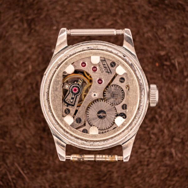 Tissot caliber 27 manual wind movement bridge signed Tissot SWISS with ruby chaton jewels and snailed wheel finishing visible