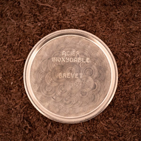Tissot Aquasport inner caseback stamped ACIER INOXYDABLE and BREVET with circular brushed snailing pattern