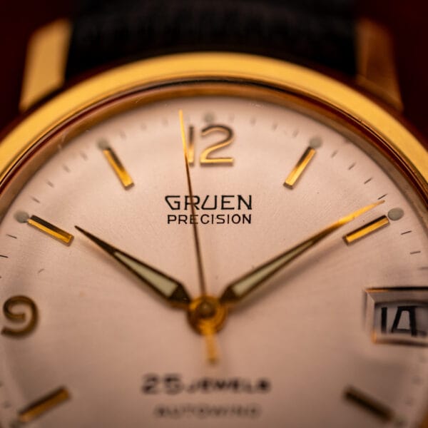 Vintage Gruen Precision dial close-up, applied gold open Arabic 12, dauphine handset with luminous insets, 25 JEWELS AUTOWIND