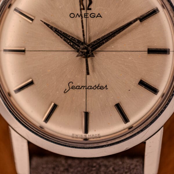 Omega Seamaster 135.005 lower dial close-up showing cursive Seamaster script above the SWISS MADE marker at six