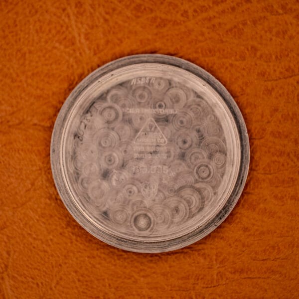 Omega Seamaster 135.005 inner caseback dust cover stamped ACIER INOXYDABLE with the Omega Watch Co. triangle logo