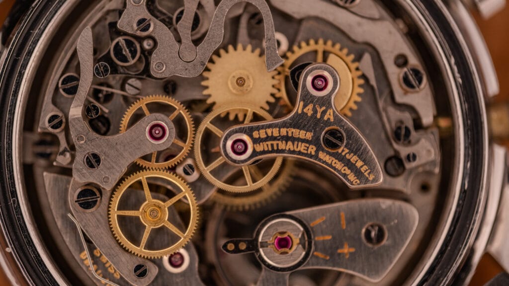 Vintage Wittnauer chronograph caliber 14YA, the house designation for the Landeron 248, shown caseback-off with the cam-lever chronograph architecture visible and the bridge signed Wittnauer Watch Co Inc, Seventeen Jewels