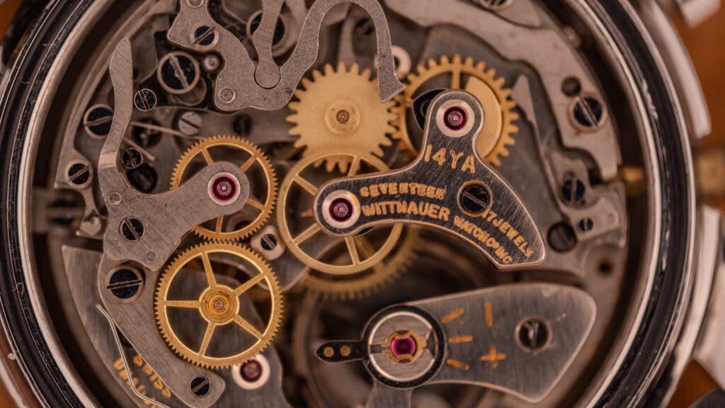 Vintage Wittnauer chronograph caliber 14YA, the house designation for the Landeron 248, shown caseback-off with the cam-lever chronograph architecture visible and the bridge signed Wittnauer Watch Co Inc, Seventeen Jewels