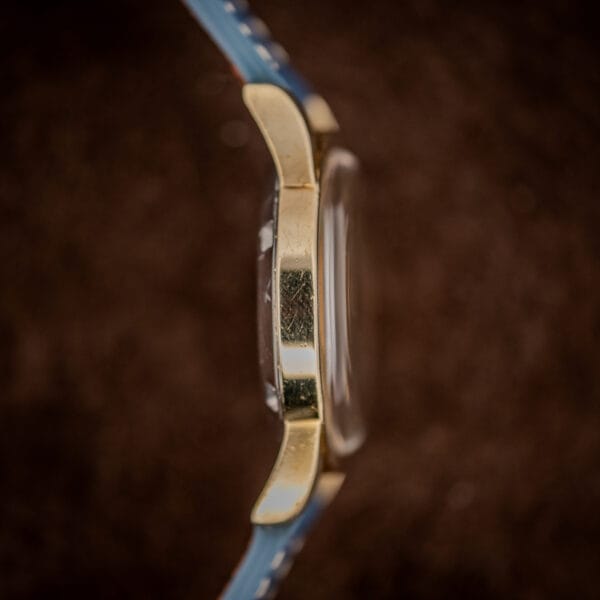 Omega Seamaster 2577-19 case side profile, gold cap over steel with domed acrylic crystal