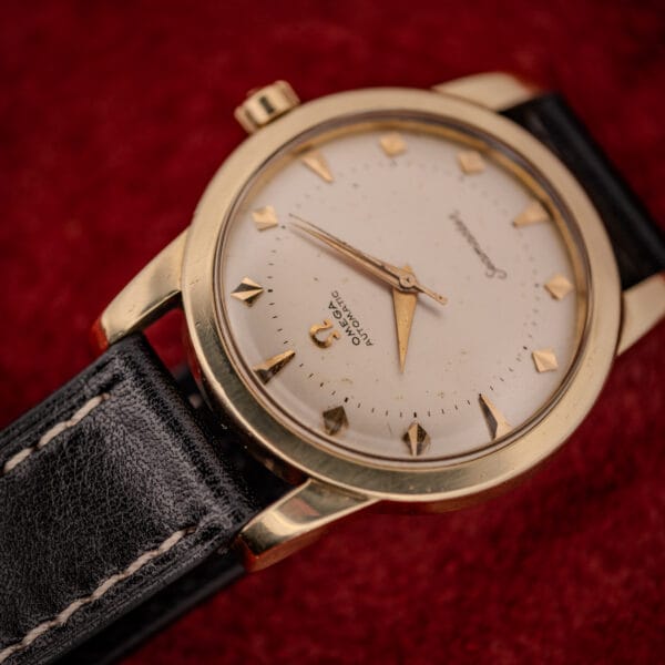 Omega Seamaster 2577-22 gold-capped case angled view with two-tier cream dial and signed Omega crown