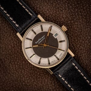 Girard-Perregaux Gyromatic two-tone tuxedo dial, silver chapter ring around a dark center, gold baton markers and date at three