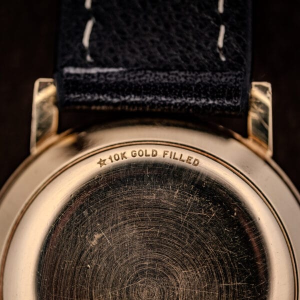 Close-up of the Girard-Perregaux caseback stamping reading ★10K GOLD FILLED