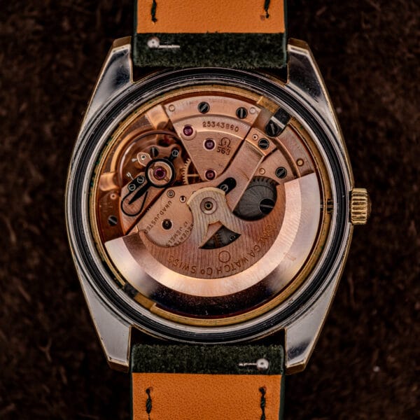 Omega caliber 563 automatic movement, copper-toned, signed Omega Watch Co Swiss with serial 25343860
