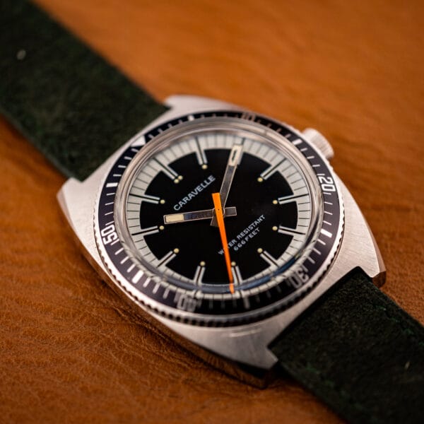 Caravelle 666 Feet diver black dial and rotating elapsed-time bezel viewed at an angle
