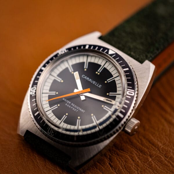 Caravelle Devil Diver dial detail showing applied fish emblem cartouche at three oclock