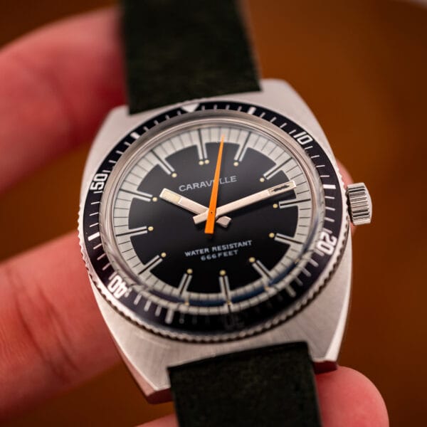 Caravelle Devil Diver 666 Feet black dial straight-on with orange seconds hand and dive bezel
