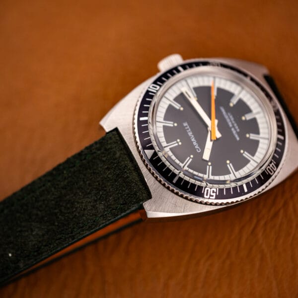 Caravelle Devil Diver 3286-DP cushion case and forest green suede strap angled on tan leather
