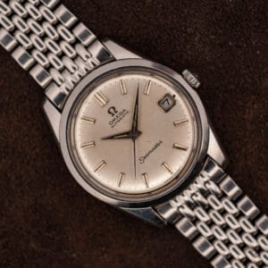 Omega Seamaster 166.010 silver dial with date at three on a steel beads-of-rice bracelet, full front view