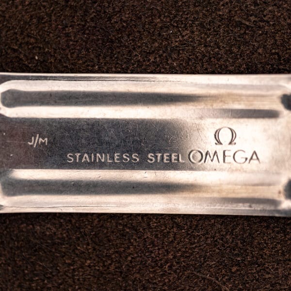 Omega folding clasp underside stamped STAINLESS STEEL OMEGA with J/M maker mark
