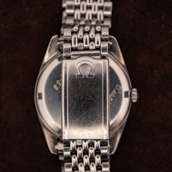 Omega Seamaster 166.010 signed Omega folding clasp on a steel beads-of-rice bracelet