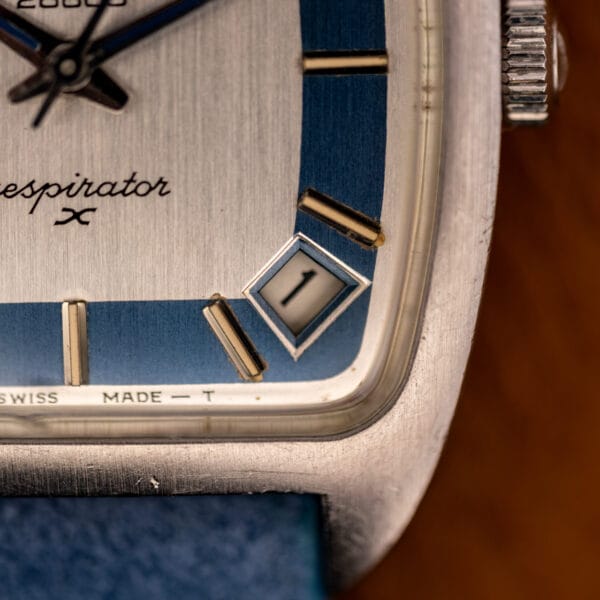 Zenith Respirator X diamond-shaped date aperture and gold baton markers on the recessed powder-blue chapter ring