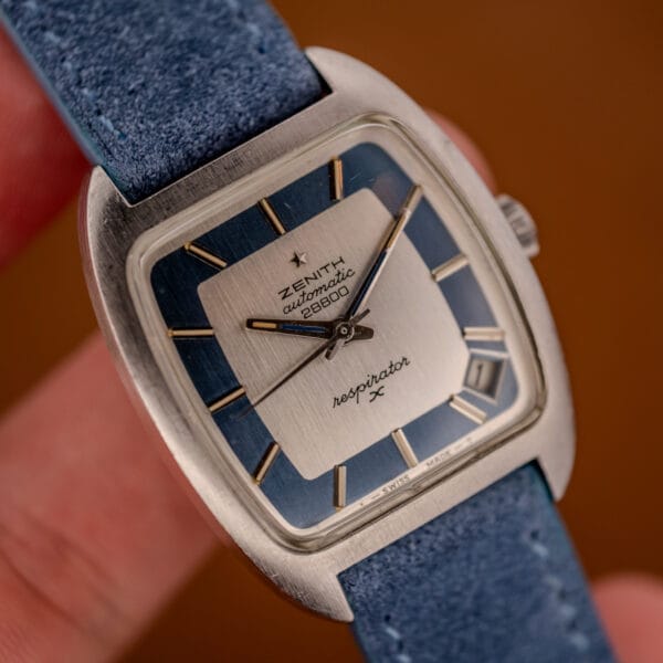 Zenith Respirator X tonneau automatic with silver and blue dial, date between four and five, on blue suede
