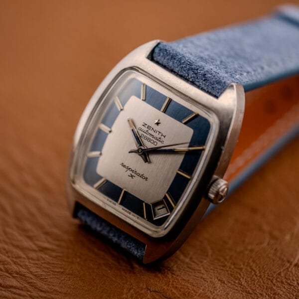 Zenith Respirator X in hand, powder-blue chapter ring framing the silver center panel marked ZENITH automatic 28800