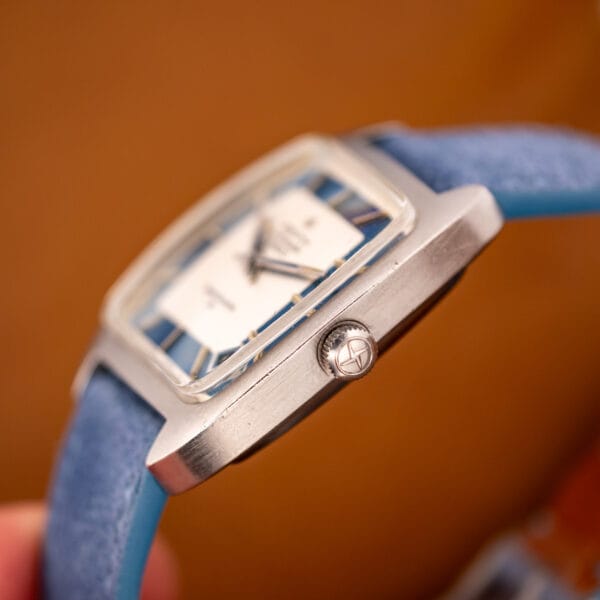 Zenith Respirator X side view in hand with faceted crystal edge and star-signed crown at three o'clock