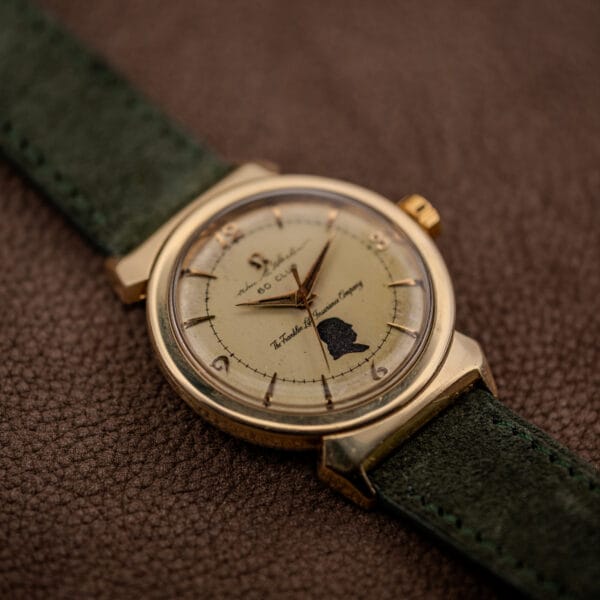 Vintage Omega Seamaster 14363 three-quarter angle with signed gold Omega crown and hooded lug case