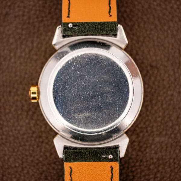 Omega Seamaster 14363 stainless steel snap caseback showing honest hairlines and an unengraved polished surface