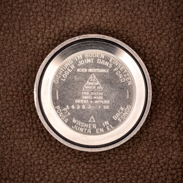 Omega inner caseback stamped 14363-1 SC, ACIER INOXYDABLE, FAB. SUISSE beneath the Omega Watch Co triangle