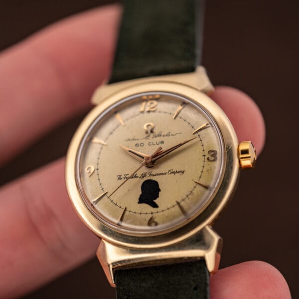 Vintage Omega caliber 500 presentation watch dial showing Benjamin Franklin silhouette and dauphine hands