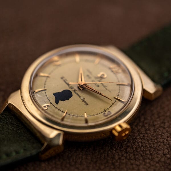 Omega hooded lugs Seamaster 14363 low-angle case profile with gold-capped lugs and signed Omega crown
