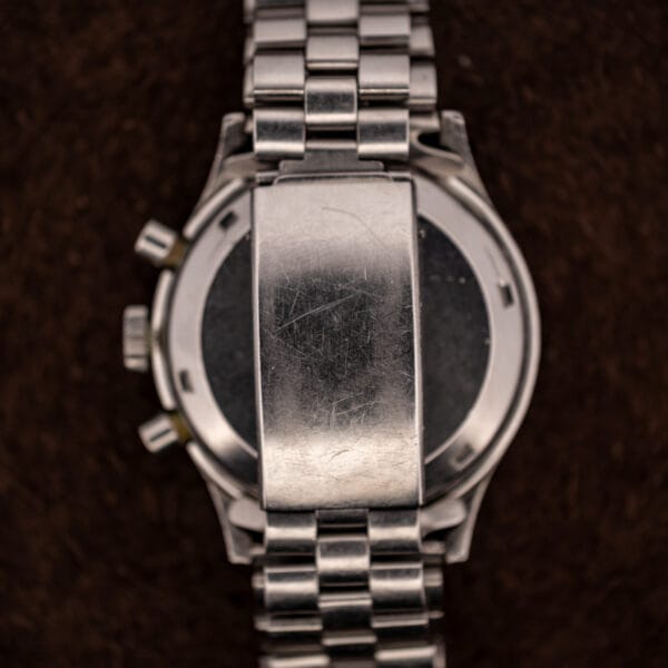 Brushed stainless caseback and Kreisler Stelux folding clasp on the Wittnauer Professional Chronograph showing honest decades of wear