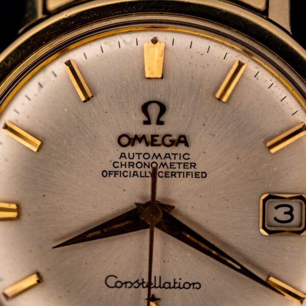 Omega Constellation 168.004 dial close-up showing the applied Omega logo and AUTOMATIC CHRONOMETER OFFICIALLY CERTIFIED printing