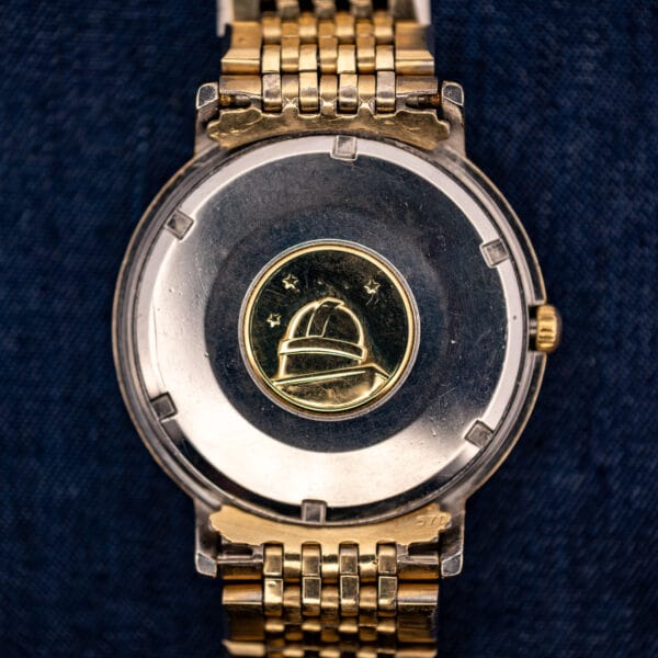 Omega Constellation 168.004 caseback observatory medallion, eight stars above the Geneva observatory on a steel screw-back