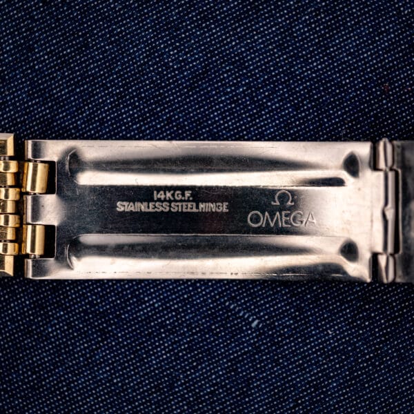 Omega Constellation bracelet clasp interior stamped 14K G.F., STAINLESS STEEL HINGE, and the Omega symbol