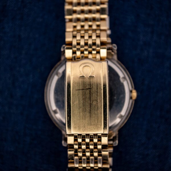 Omega Constellation 14k gold-filled folding clasp with engraved Omega symbol and honest surface wear from use