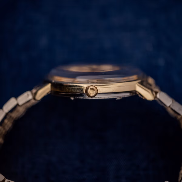 Omega Constellation 168.004 case profile with Omega-signed crown and domed acrylic crystal
