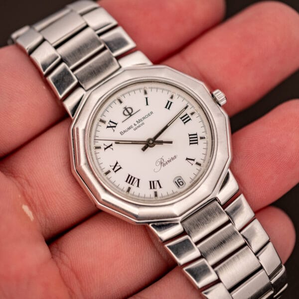 Baume & Mercier Riviera 5131.2 held in hand showing the compact 34mm dodecagonal case and steel bracelet